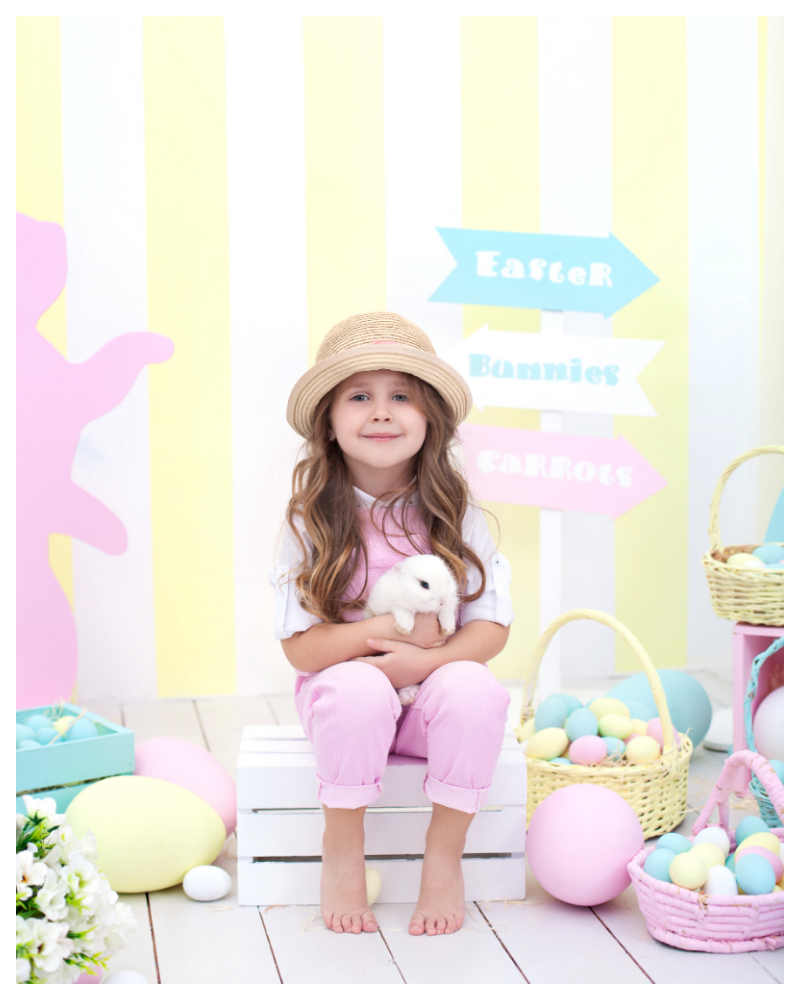 Easter photo with girl holding bunny